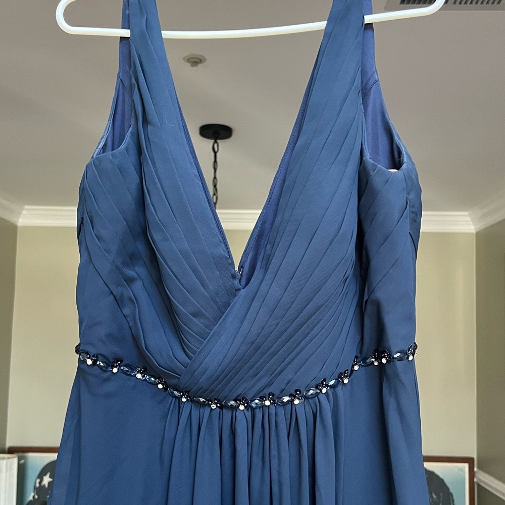 Navy gown, JJ’s House, no tags but never worn. Size 18, but runs a bit small.